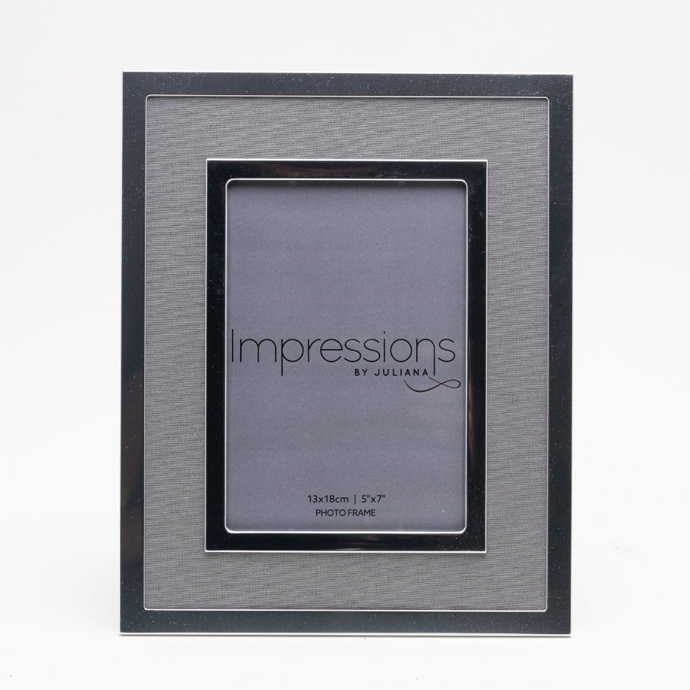 Silver Plated Photo Frame with Grey Linen Insert 5" x 7"  Give a precious photo the perfect place to shine with this stylish silver plated photo frame with a grey linen insert. From Impressions - helping your precious picures speak their thousand words.