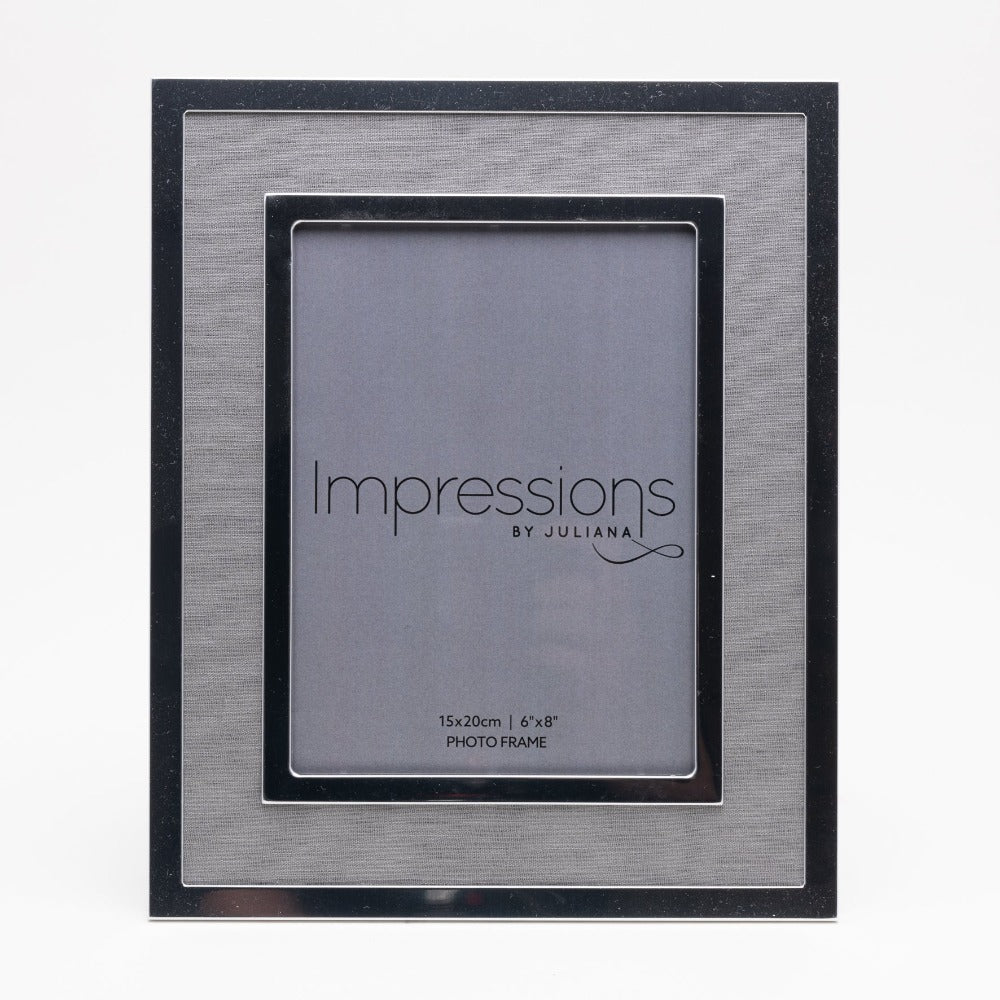 Silver Plated Photo Frame with Grey Linen Insert 6" x 8"  Give a precious photo the perfect place to shine with this stylish silver plated photo frame with a grey linen insert. From Impressions - helping your precious picures speak their thousand words.