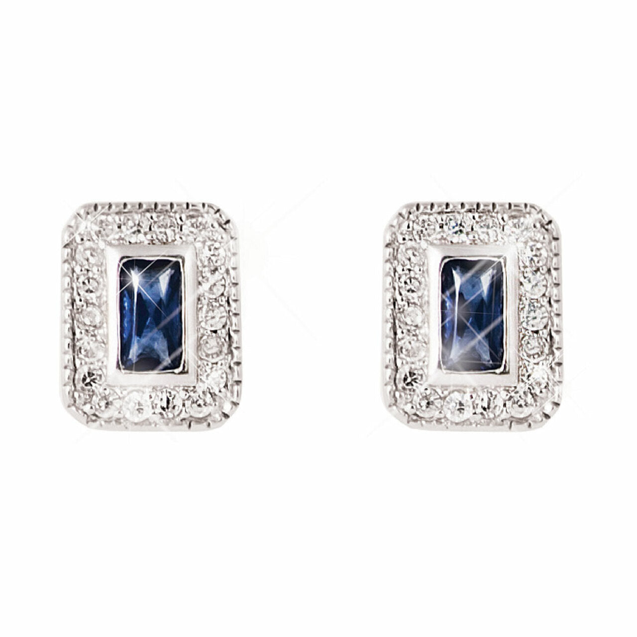 Tipperary Crystal Silver Stud Earrings Sapphire Centre White Surround  Elegance and pizzaz are presented in equal measure with these rich sapphire earrings. The halo frame of bright, round, clear crystals intensiﬁes the radiance of the blue emerald cut center stone.