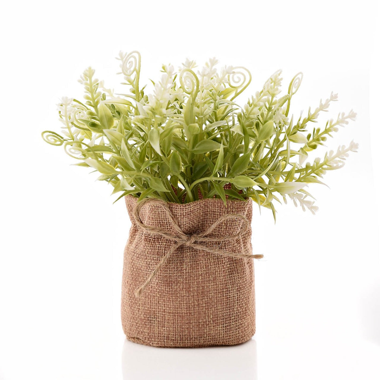 Small Faux Plant In Hessian Bag 17 cm  A wholesome, rustic, and vintage answer to house plants, this cute and stylish hessian bag features a gorgeous faux plant that will bring some green into your living space.