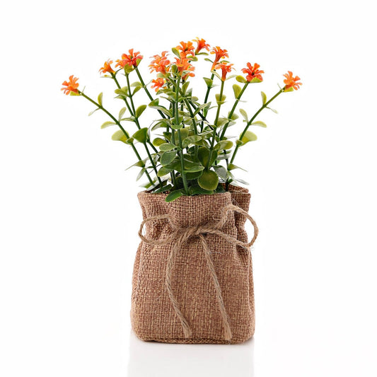 Small Yellow Faux Plant In Hessian Bag 16.5 cm  A wholesome, rustic, and vintage answer to house plants, this cute and stylish hessian bag features a 'love' print and a faux yellow plant that will welcome some fresh colour into any living space this spring.