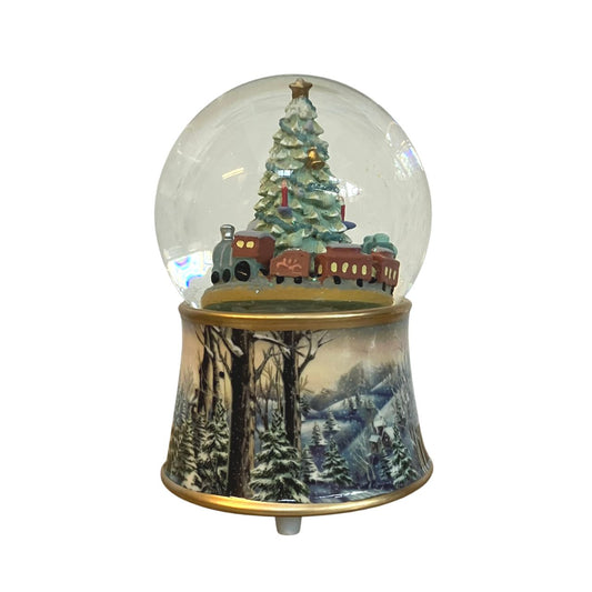 Music Box World Snow Globe Christmas Tree with Train  Featuring festive scenes and characters, add charm and personality to your home this Christmas with our fabulous snow globes  The Scene in the globe rotates to the melody “Oh Christmas Tree”