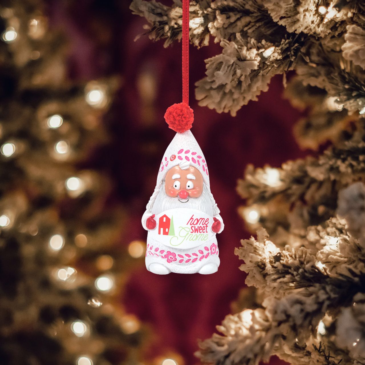 Department 56 Snowpinions Snow Gnome Home Sweet Gnome Hanging Ornament  Celebrate your home with this Snow Gnome, Hanging on a red ribbon, he has been hand crafted from high quality cast stone and then hand painted by our talented artists. Perfect for any Christmas tree.