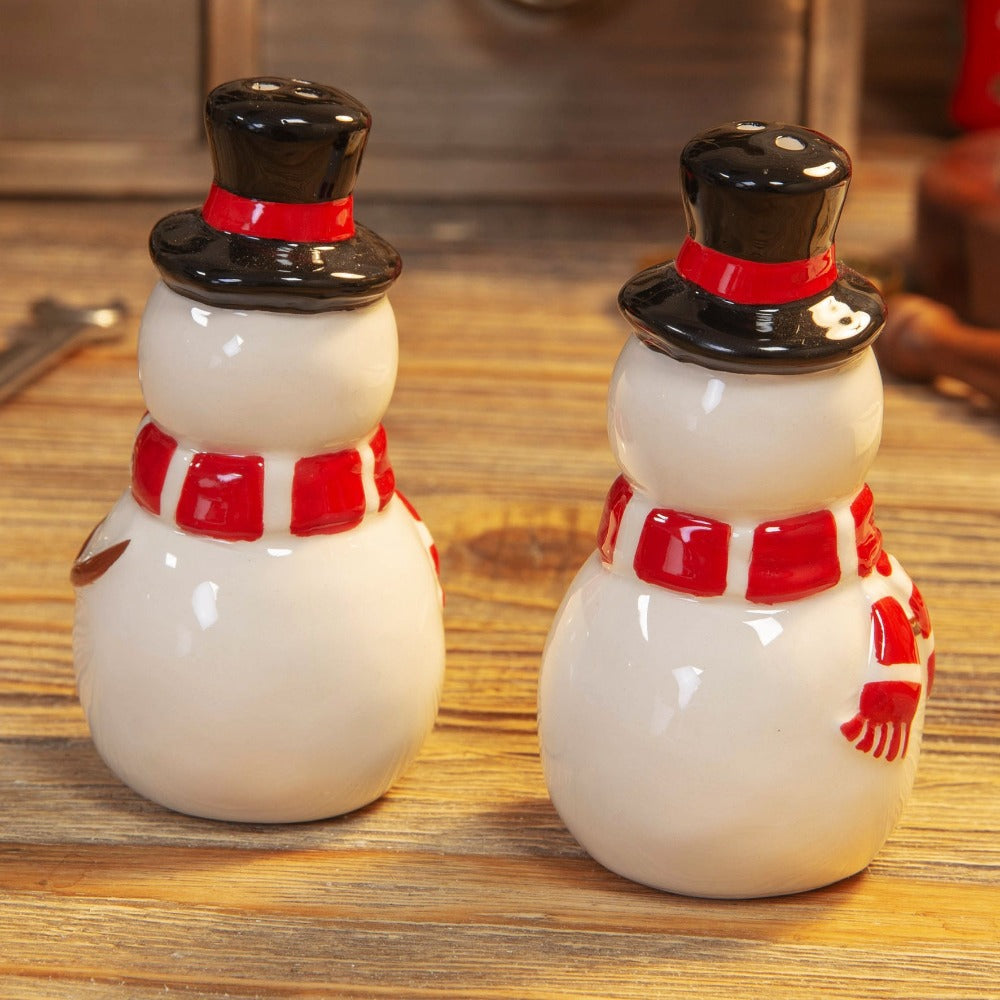 Christmas Festive Snowman Salt & Pepper Shakers  Bring some extra festive cheer to the Christmas dinner table with these hand painted ceramic snowman salt & pepper shakers. From the North Pole Novelties Co. by Santa's Workshop - the one stop shop for Christmas cheer!