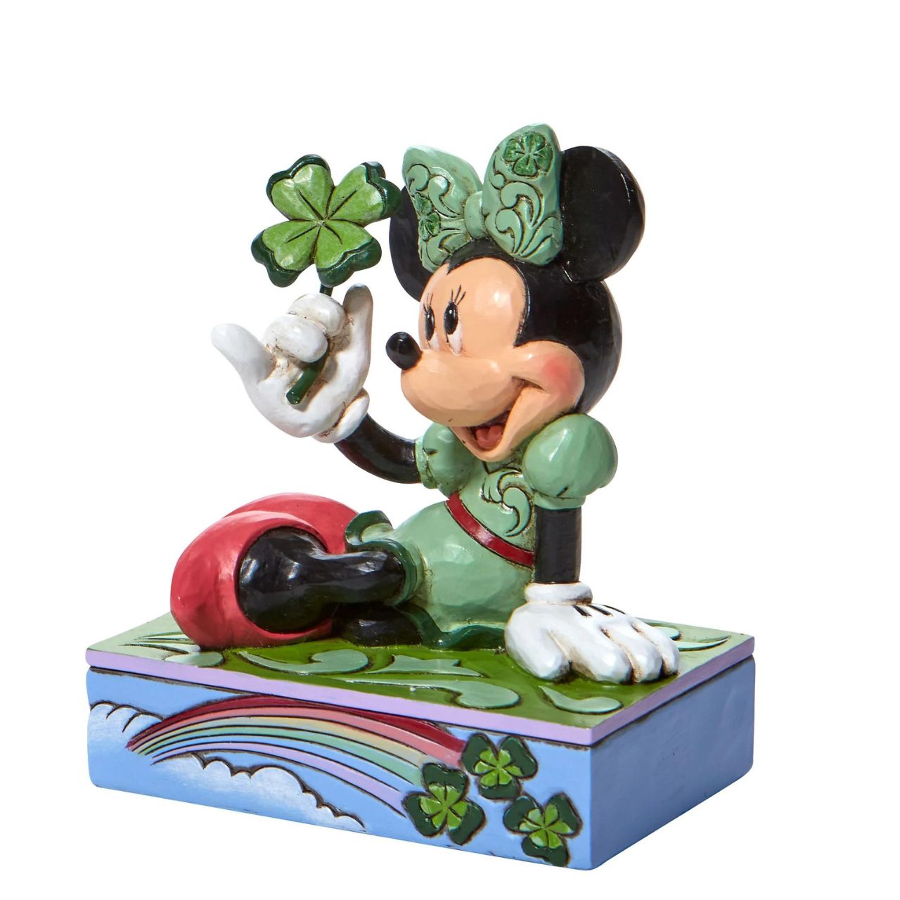 St. Patrick's Minnie Mouse Personality Pose Figurine  "Shamrock Wishes" Luck be a lady, Minnie Mouse is the pot of gold at the end of this Walt Disney rainbow! Dressed in an amorous emerald gown, the kittenish mouse holds a clover for you this St. Patrick's Day. With matching bow and base, this Jim Shore design is a charmer.