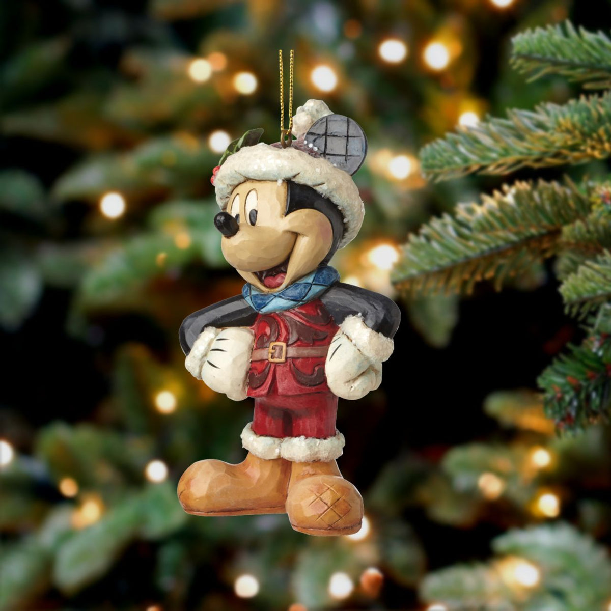 Jim Shore Sugar Coated Mickey Mouse Hanging Ornament  This colourful ornament of Mickey Mouse features sparkling sugary accents. Handcrafted in dazzling detail, this delightful ornament combines the beloved Disney characters with the artistry of Jim Shore.