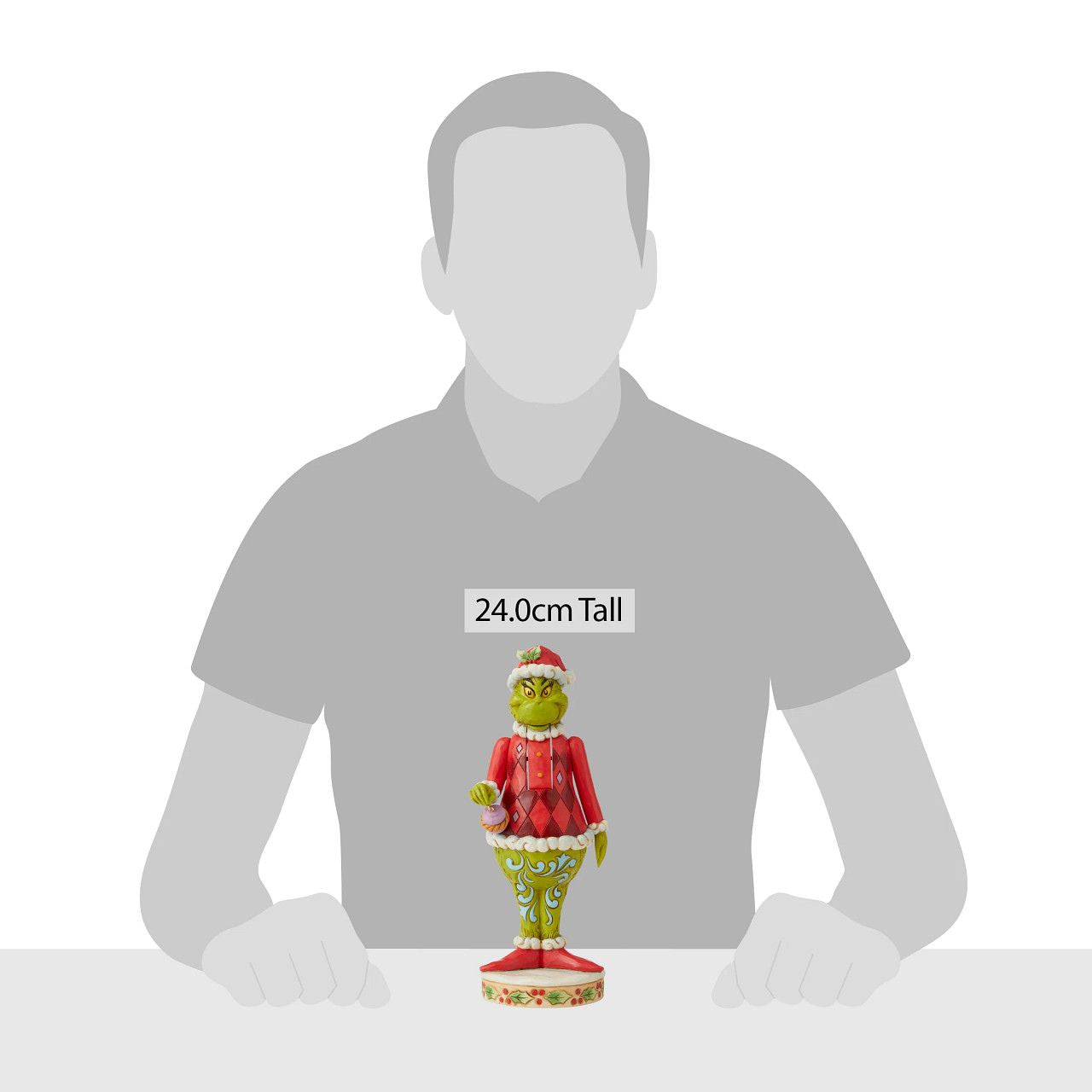 Grinch Nutcracker Figurine - The Grinch by Jim Shore  Marrying two beloved holiday figures, Jim Shore creates a Grinch Nutcracker that captures the grump in all his glory. With holly brimmed in his Santa hat, no one dares kiss this Christmas curmudgeon for fear of being cracked across the face.