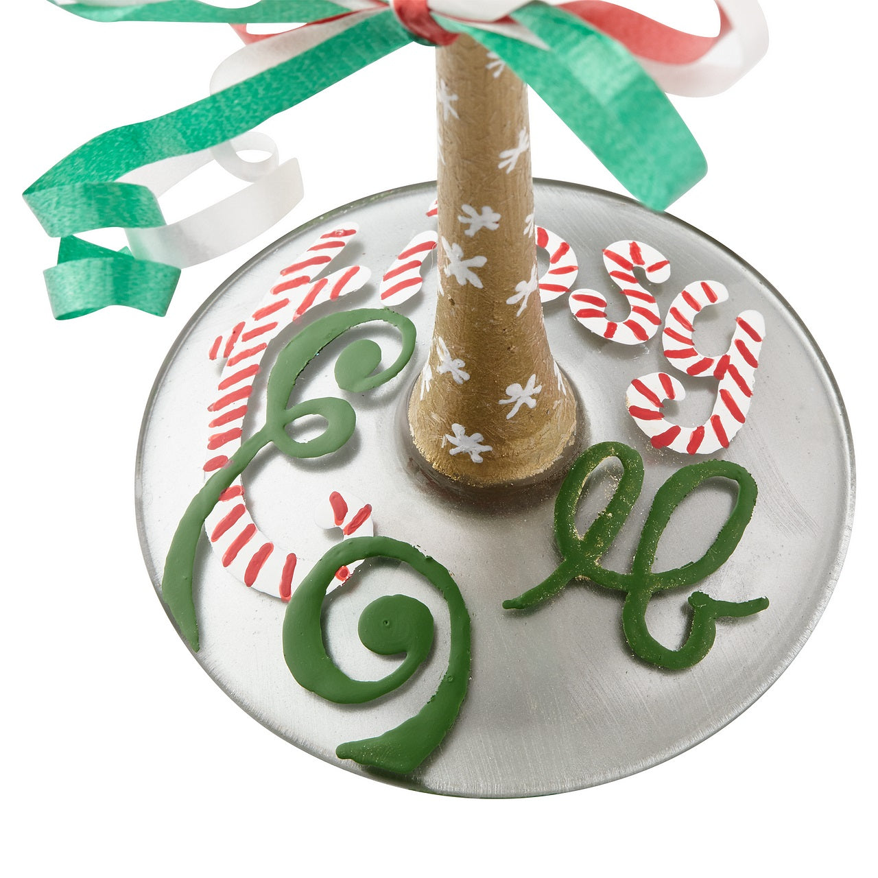 Tipsy Elf Wine Glass  Gleeful and gulping, the little elves decking this glass are sure to delight and intoxicate your holiday. Arrives in a beautiful gift box with signature recipe. Artisan blown glass. Hand wash only.