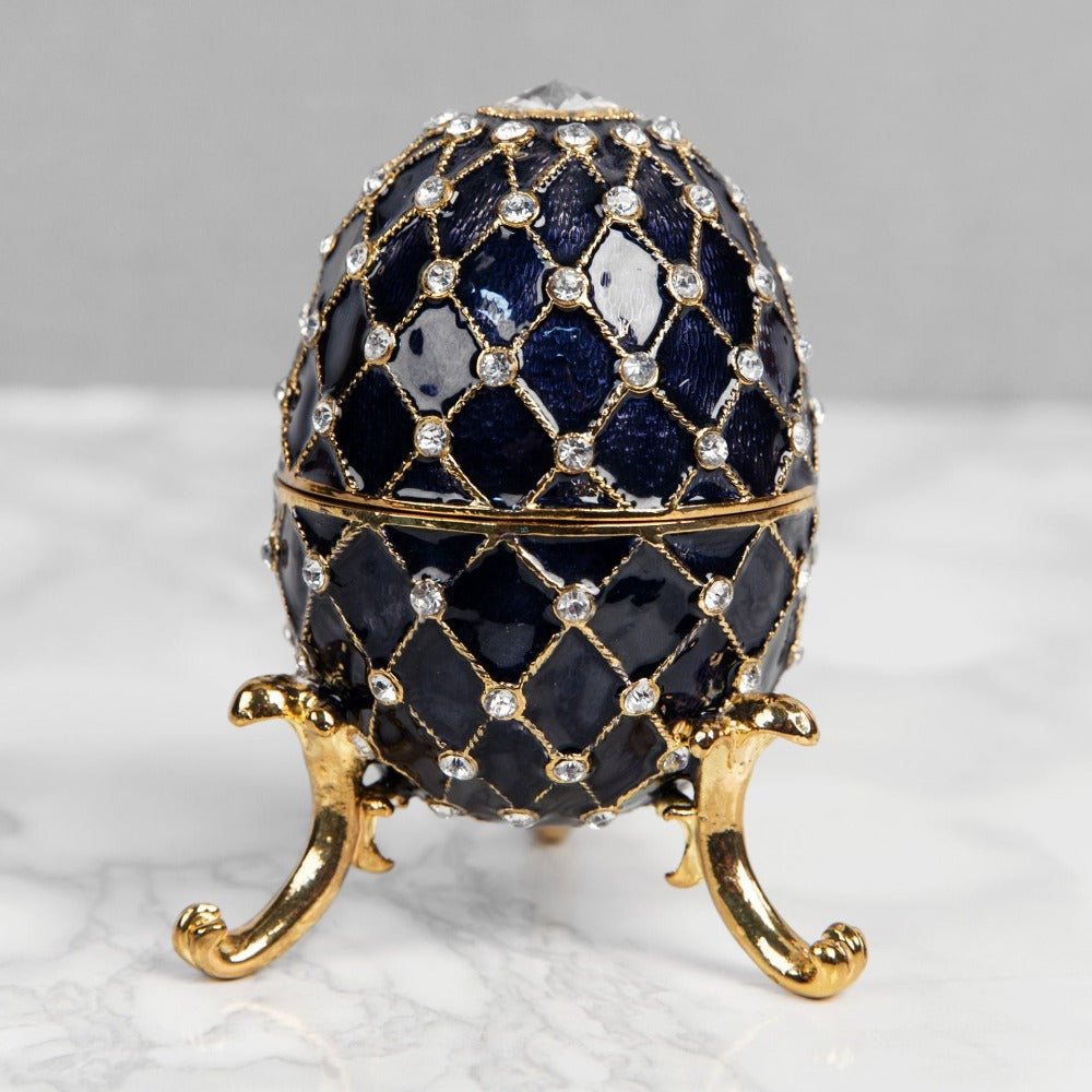 Treasured Trinkets - Large Fabergé Egg Blue  A beautiful, hand painted and crystal finished Fabergé egg trinket box from Treasured Trinkets.  Painted in a resplendent blue colour with stunning gold and crystal patterns, this trinket box is a wonderful ornament to complement a mantelpiece, bookcase or cabinet.