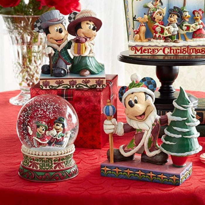 Jim Shore Splendid Skaters - Victorian Mickey and Minnie Mouse Waterball  Mickey and Minnie Mouse are filled with Christmas spirit as they ice skate in this victorian inspired waterball.