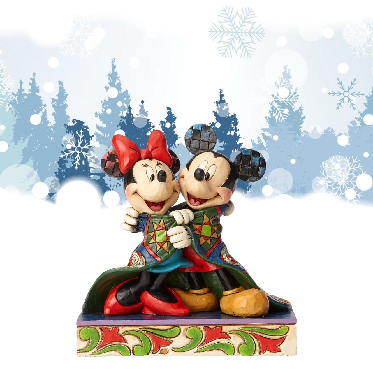 Jim Shore Warm Wishes Mickey and Minnie Mouse Figurine  Remember those cosy winter nights and lazy mornings, lounging in your new Christmas PJ's sipping hot chocolate and watching your favourite Disney film? This was the inspiration for this Mickey Mouse personality pose by Jim Shore.