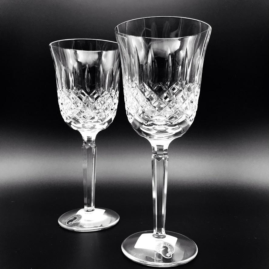 Kelsey Wine Pair by Waterford Crystal  Kelsey Collection by Waterford is characterized by a simple demi-lune shape accented by an open diamond pattern and adorned with single wedge cuts.