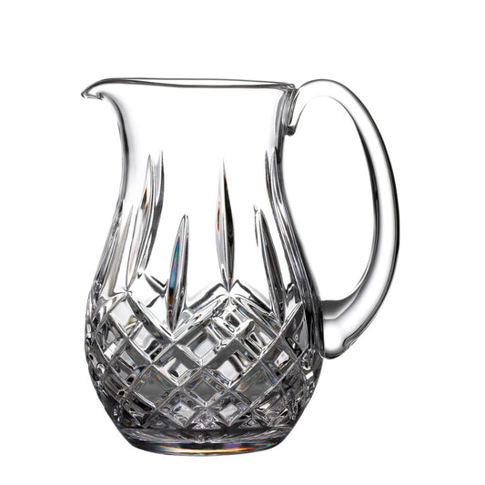 Waterford Lismore Pitcher  This elegant Lismore Pitcher brings luxury style to entertaining at home, as you confidently pour homemade lemonade, iced water or a refreshing fruit punch for welcome guests. Crafted from the finest crystal, this generously proportioned jug pitcher has a reassuring weight and sturdy handle that makes pouring the perfect serving simply effortless. 