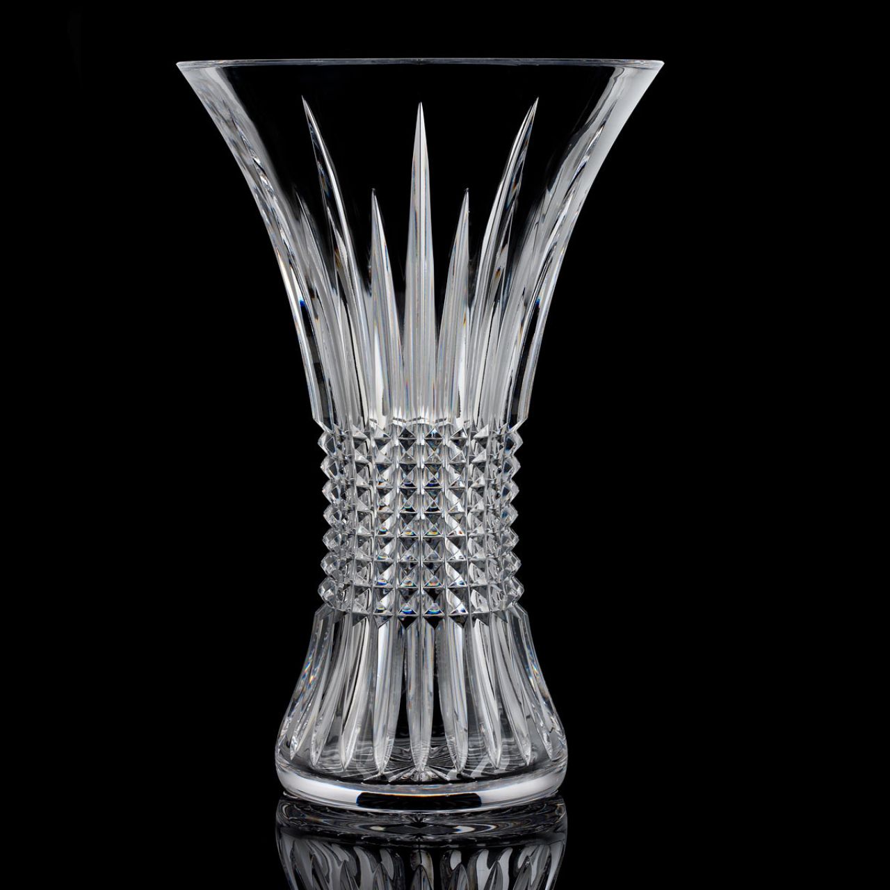 Lismore Diamond 14 in Vase by Waterford Crystal  Perfect for displaying a floral bouquet or two dozen roses, this Lismore Diamond 14in Vase beautifully showcases its contents. The combination of its tall, 14in profile and enchanting flared rim enables cut flowers to stretch out into their surroundings, producing an eye-catching display of colour that breathes life into your home.