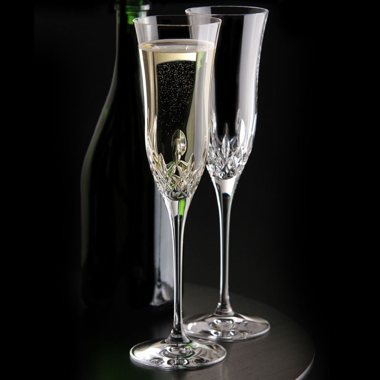 Lismore Essence Champagne Flute Pair by Waterford Crystal  Bring sheer excellence to your celebrations with our pair of Lismore Essence Champagne Flutes : an elegant, contemporary statements that provides the perfect serve for sparkling wine, mimosas, spumante or champagne cocktails.