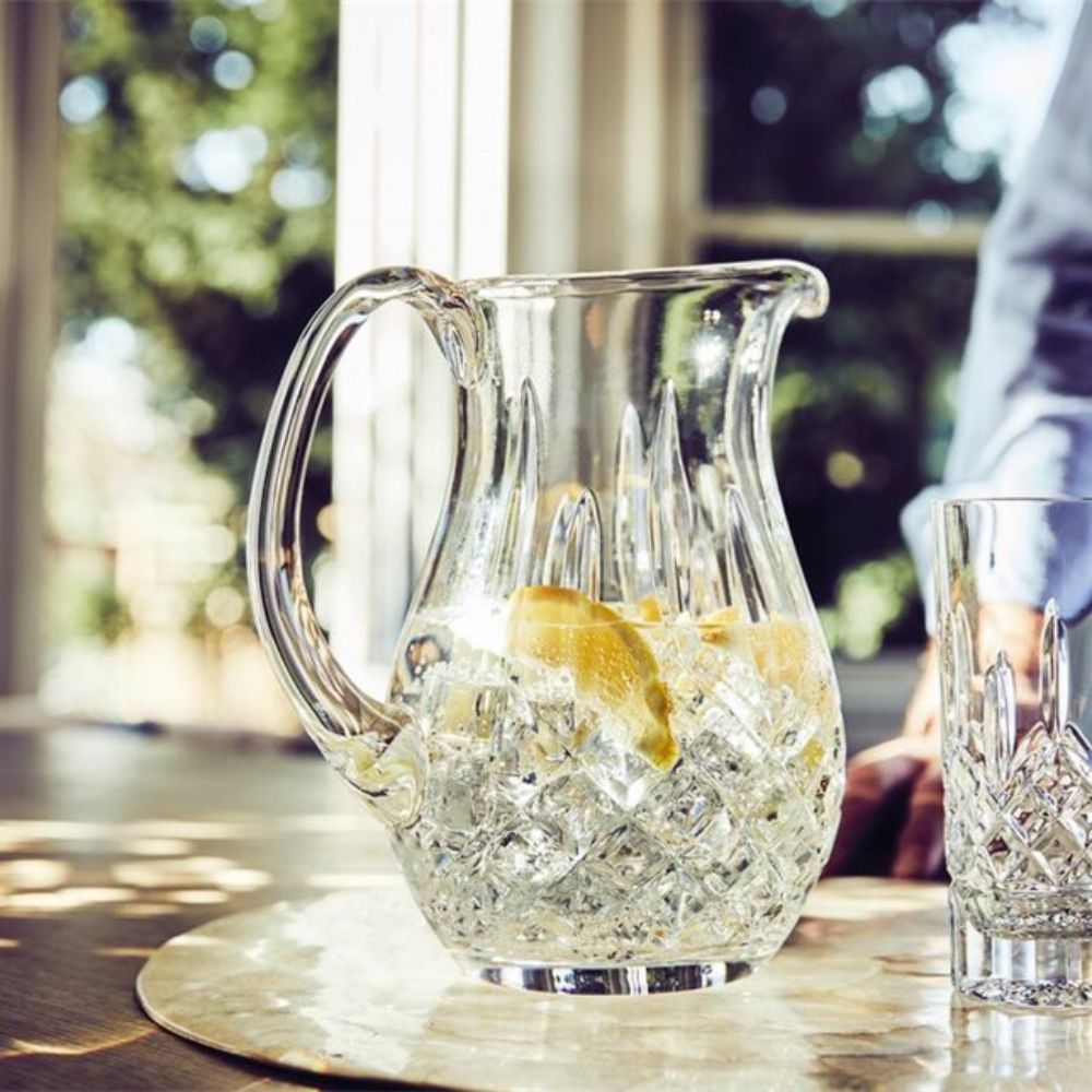 Waterford Lismore Pitcher  This elegant Lismore Pitcher brings luxury style to entertaining at home, as you confidently pour homemade lemonade, iced water or a refreshing fruit punch for welcome guests. Crafted from the finest crystal, this generously proportioned jug pitcher has a reassuring weight and sturdy handle that makes pouring the perfect serving simply effortless. 