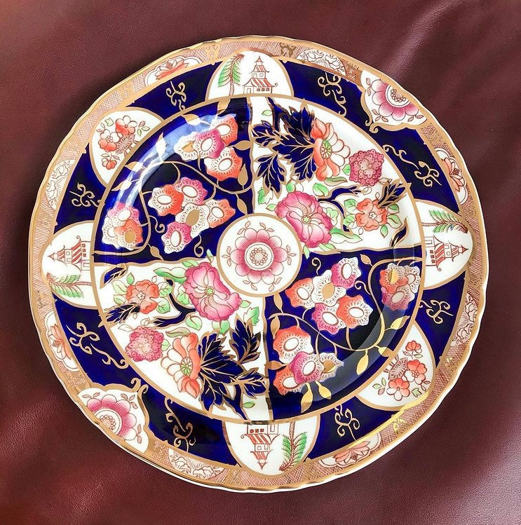 Wedgwood Masons Ironstone Penang Dinner Plate  Mason's Ironstone 'Penang' Plate. Made in England.  This stunning PENANG Pattern plate was Made in England by Mason's Ironstone. It measures 27 cm diameter (10.5"), and is hand painted in rich dark blue with pink and brown flowers and pagodas in the border. 