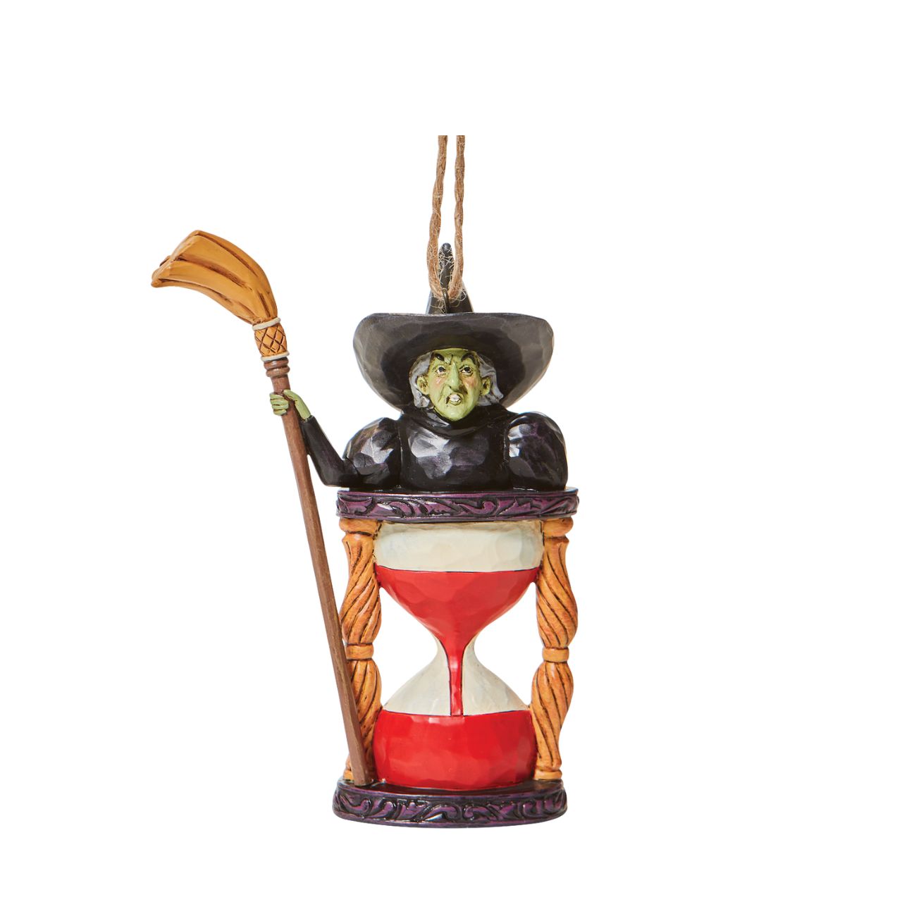 Jim Shore Wicked Witch with Hourglass Hanging Ornament  Someone looks unhappy in this hourglass ornament. As the sands of time fall, the Wicked Witch frowns knowing it's only a matter of time until good wins the day. Place this green-faced miscreant into your tree and watch her moments before melting.