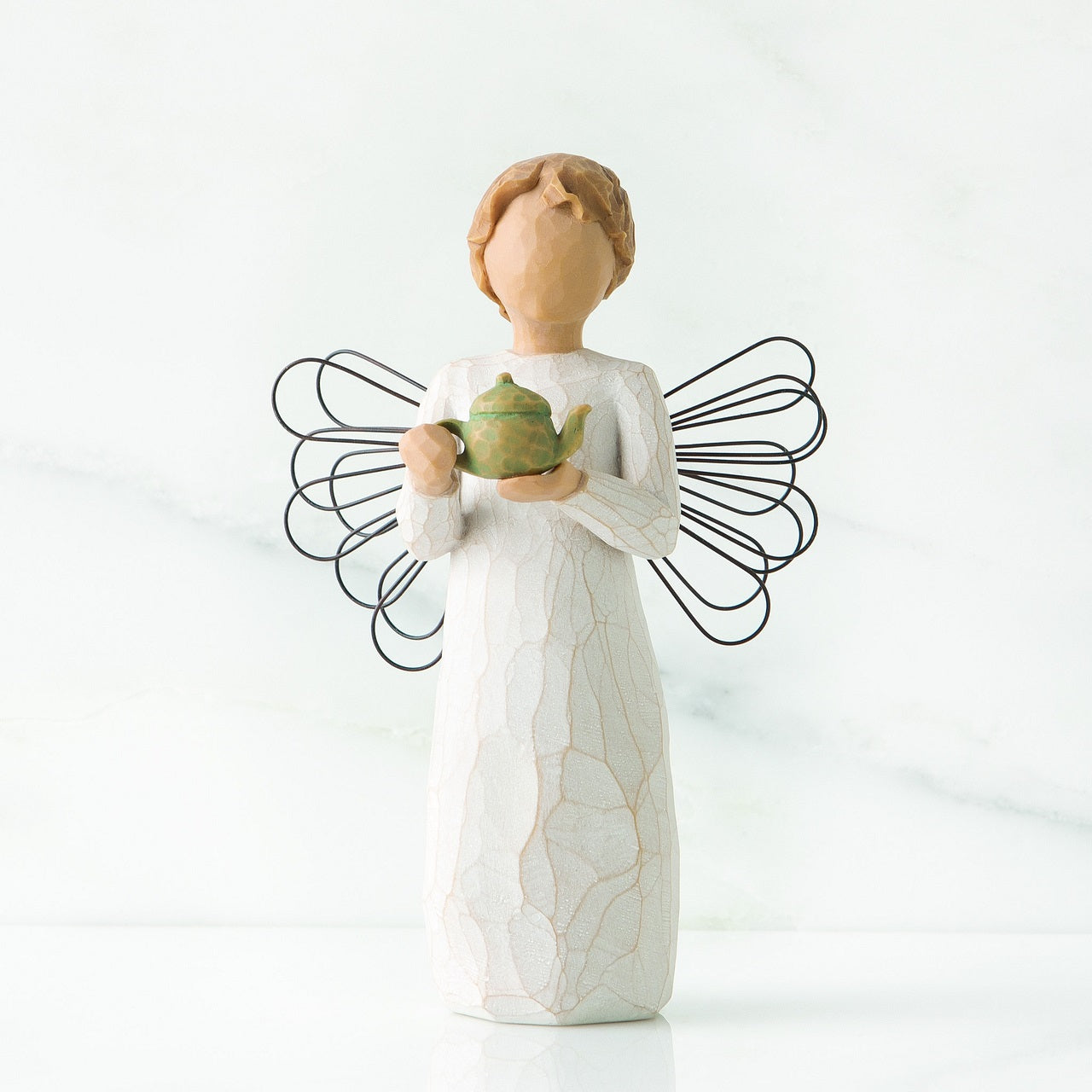 Willow Tree Angel of the Kitchen  Willow Tree is an intimate line of figurative sculptures representing sentiments of love, closeness, healing, courage, hope...all the emotions we encounter in life. Artist Susan Lordi hand carves the original of each Willow Tree sculpture.