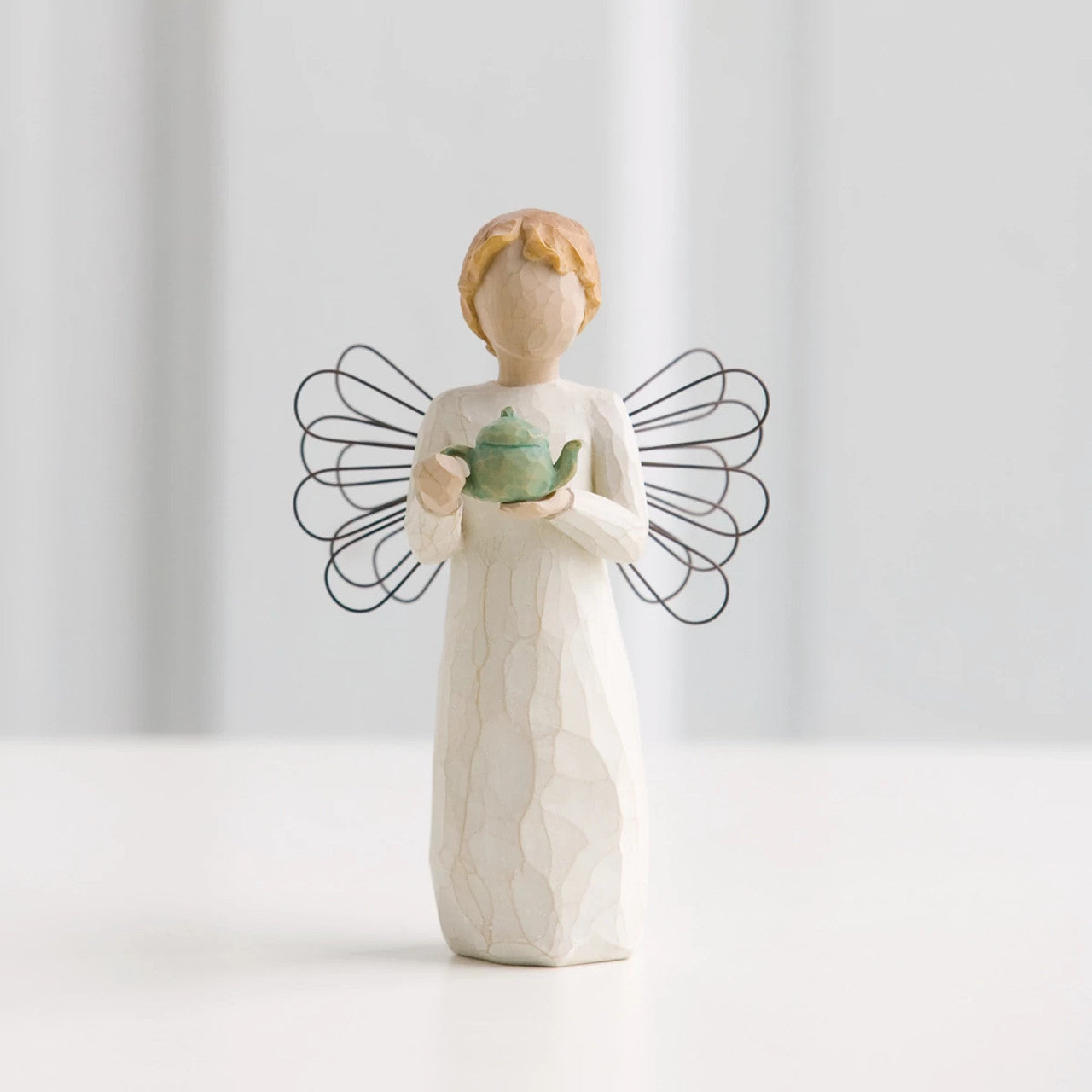 Willow Tree Angel of the Kitchen  Willow Tree is an intimate line of figurative sculptures representing sentiments of love, closeness, healing, courage, hope...all the emotions we encounter in life. Artist Susan Lordi hand carves the original of each Willow Tree sculpture.