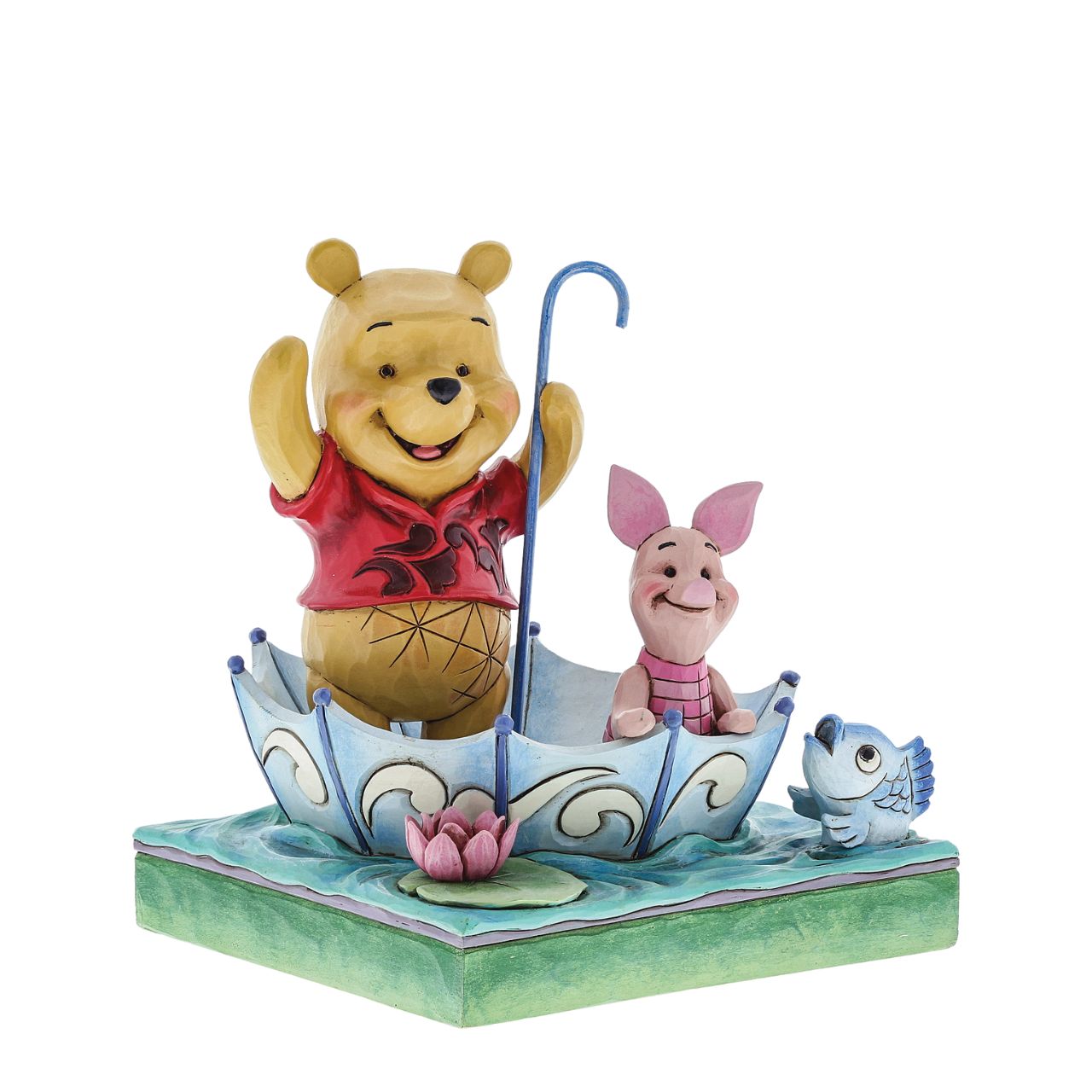 Jim Shore 50 Years of Friendship Winnie the Pooh and Piglet Figurine  Winnie the Pooh and Piglet celebrate "50 Years of Friendship" while sharing smiles and an umbrella raft in this charming creation featuring the beloved Disney characters and the heartfelt style of folk artist Jim Shore.
